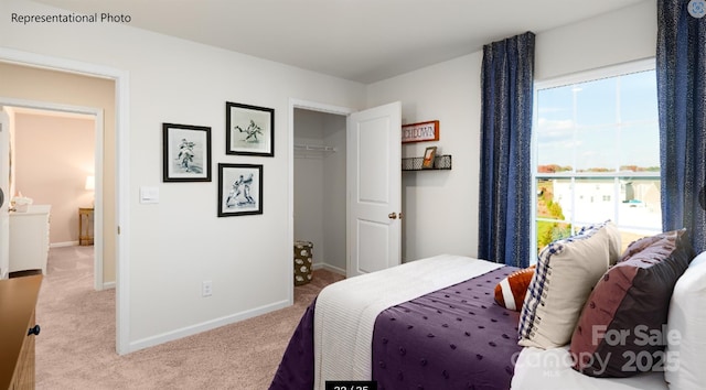 bedroom featuring light carpet and baseboards