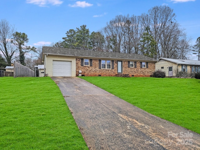 ranch-style house with a garage, a front yard, crawl space, and aphalt driveway