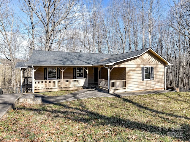 ranch-style home with covered porch and a front lawn