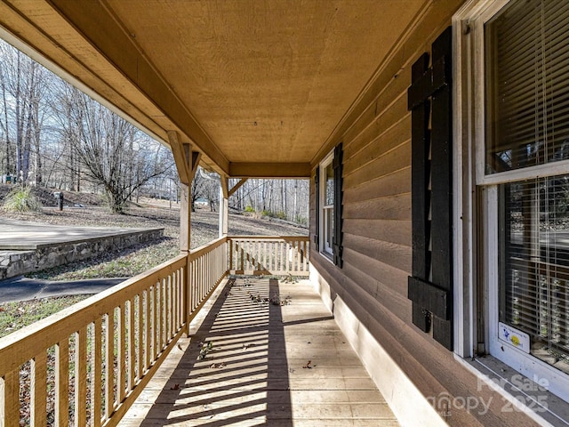 wooden deck featuring covered porch