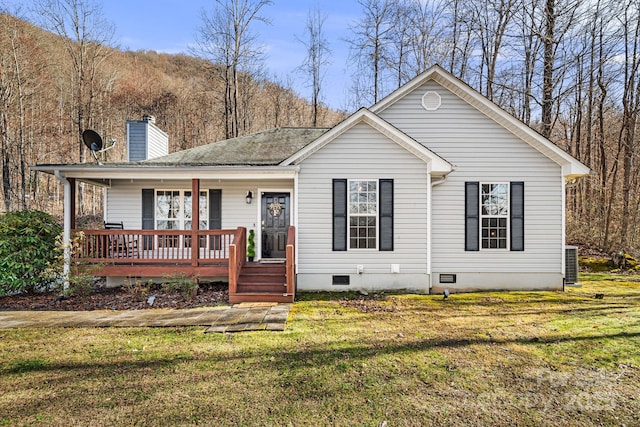 view of front of property featuring covered porch, crawl space, a chimney, and a front yard