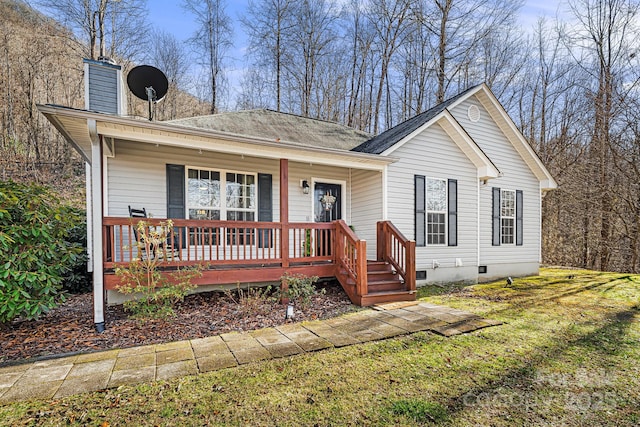 ranch-style home featuring a porch, a front yard, crawl space, and a chimney