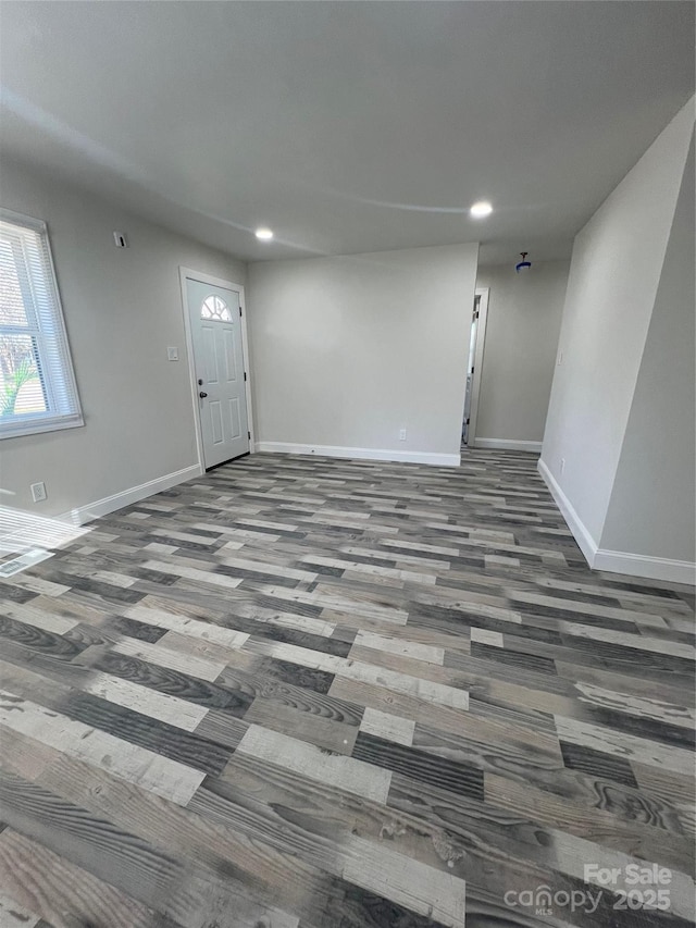 interior space featuring recessed lighting and baseboards