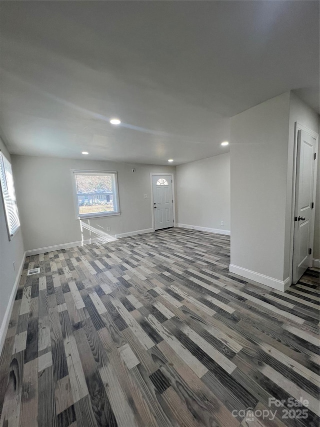 interior space featuring baseboards and recessed lighting