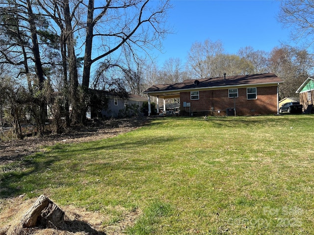 exterior space with crawl space, a yard, and brick siding