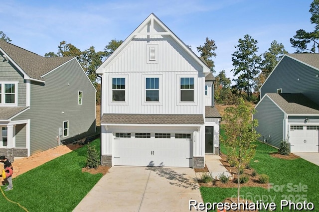 116 Shay Crossing Rd Unit 2P, Salisbury, NC 28144 - view of front of house featuring board and batten siding, concrete driveway, roof with shingles, a garage, and a front lawn