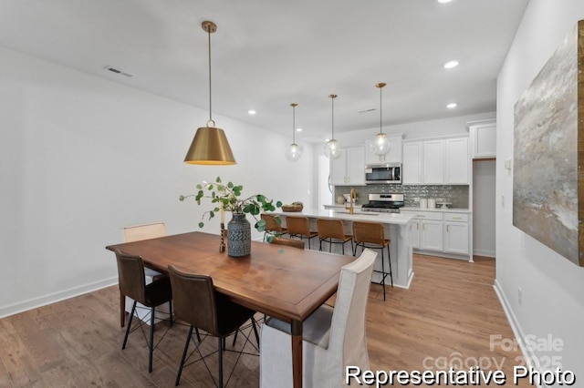 116 Shay Crossing Rd Unit 2P, Salisbury, NC 28144 - dining room featuring light wood finished floors and recessed lighting