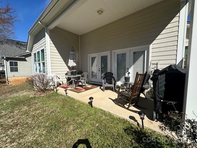 exterior space with a patio area and a yard