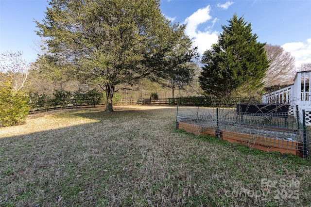 view of yard featuring a garden and fence