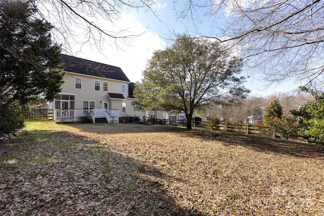 view of yard with fence and a wooden deck