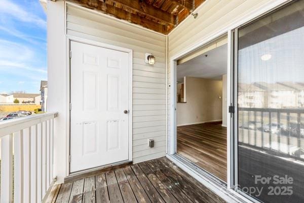 doorway to property featuring a balcony