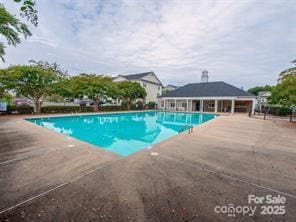 pool with a patio area