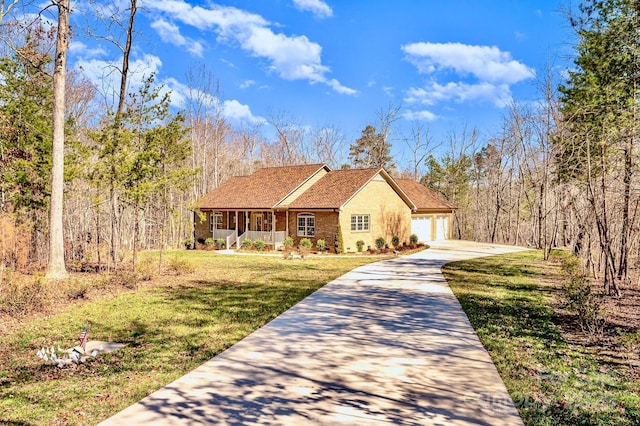 view of front of property with a garage, brick siding, driveway, roof with shingles, and a front yard