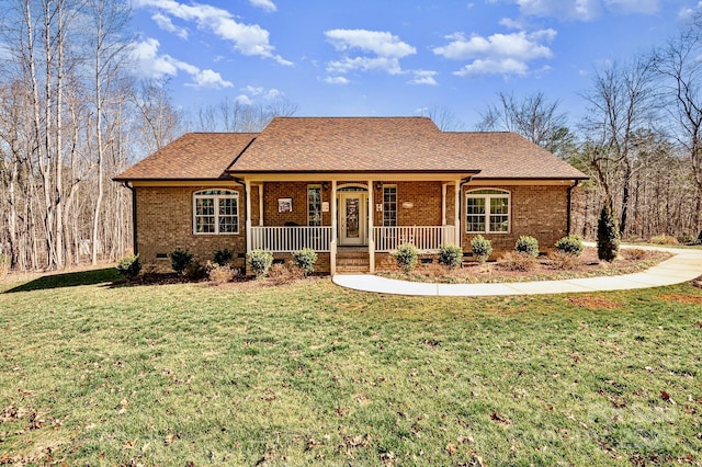 single story home with a front lawn, a shingled roof, a porch, and brick siding
