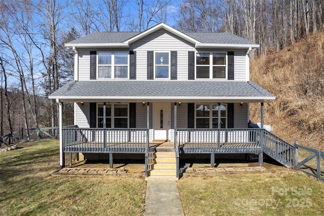 view of front facade featuring a shingled roof, stairs, a front lawn, and a porch