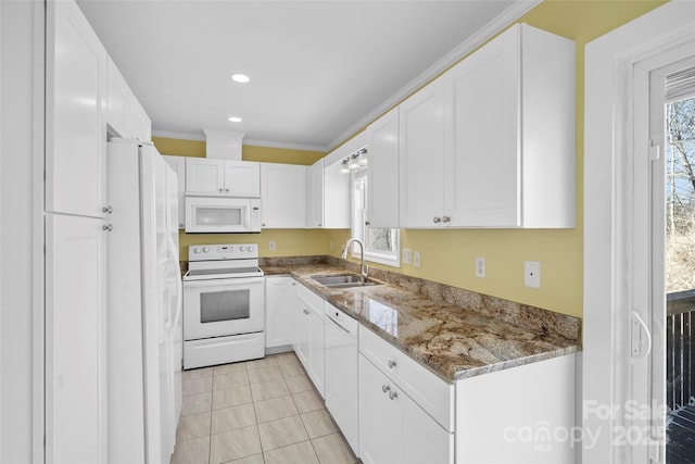 kitchen featuring white appliances, stone countertops, a sink, and white cabinets