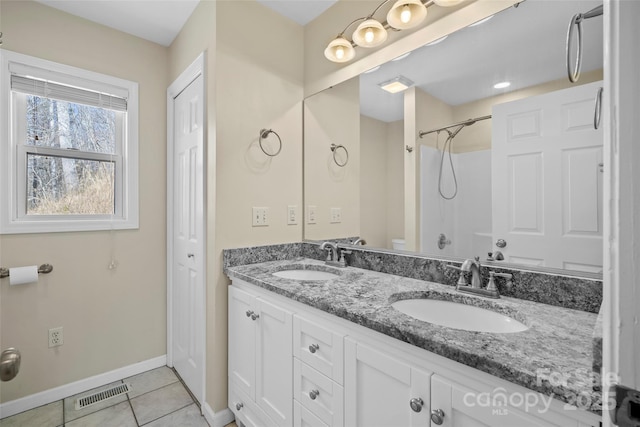 full bathroom featuring a closet, tile patterned flooring, a sink, and toilet