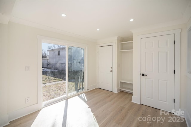 empty room featuring recessed lighting, a wealth of natural light, and light wood-style floors