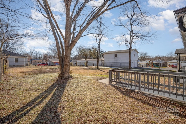 view of yard with a residential view and fence