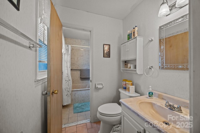 full bathroom featuring tile patterned flooring, vanity, and toilet