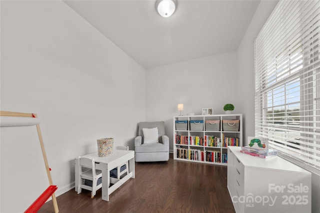 rec room featuring baseboards and wood finished floors