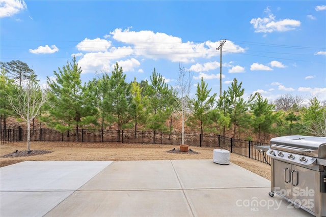 view of patio featuring fence