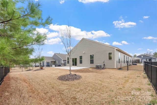 back of house with a patio area, a fenced backyard, and central AC unit