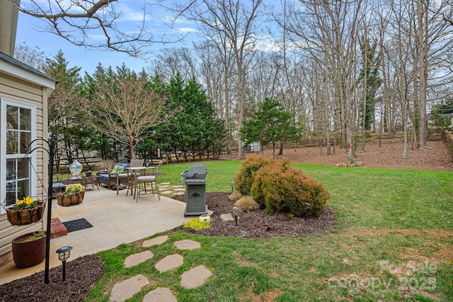 view of yard featuring a patio and fence