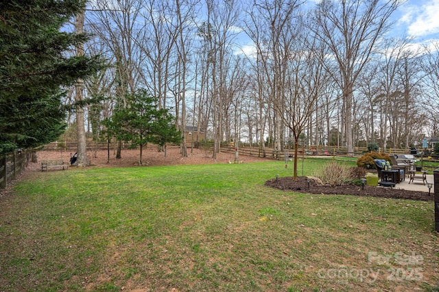 view of yard with fence and a patio