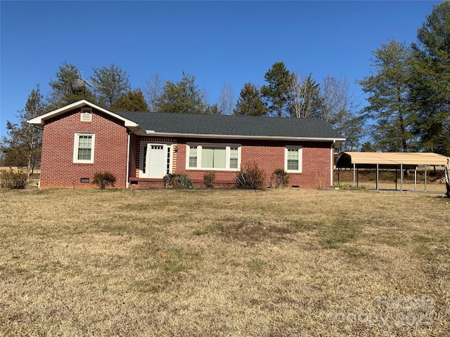 ranch-style home with brick siding, roof with shingles, a detached carport, a front yard, and crawl space