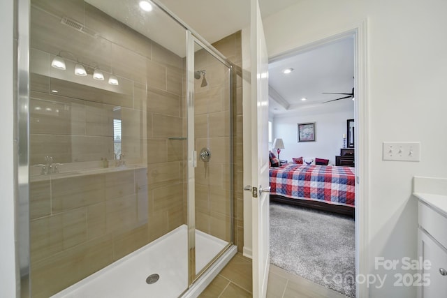 ensuite bathroom with recessed lighting, a stall shower, tile patterned floors, and ensuite bathroom