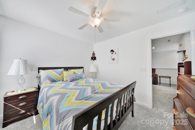 bedroom with light carpet, a ceiling fan, and baseboards