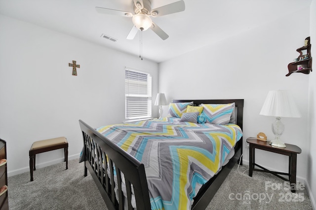 bedroom with carpet floors, visible vents, ceiling fan, and baseboards