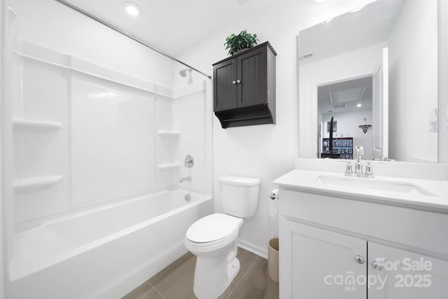 bathroom featuring shower / washtub combination, vanity, toilet, and baseboards