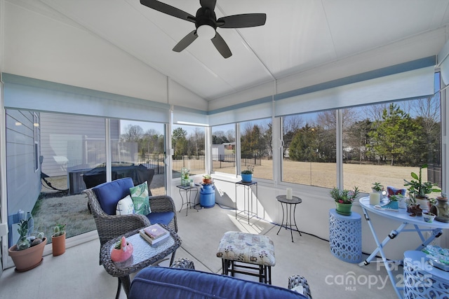 sunroom / solarium with lofted ceiling and ceiling fan