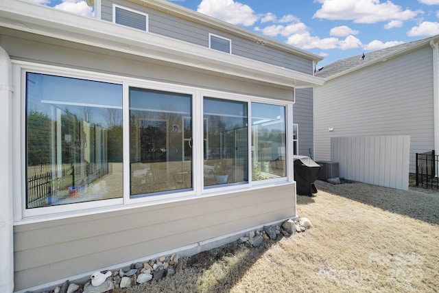 view of side of property with fence