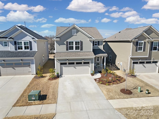 traditional home with a residential view, roof with shingles, driveway, and an attached garage