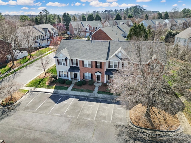 birds eye view of property with a residential view