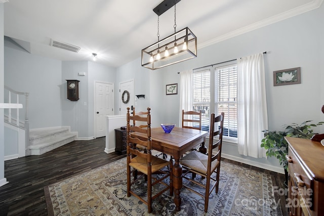 dining room featuring dark wood-style flooring, visible vents, baseboards, stairs, and ornamental molding