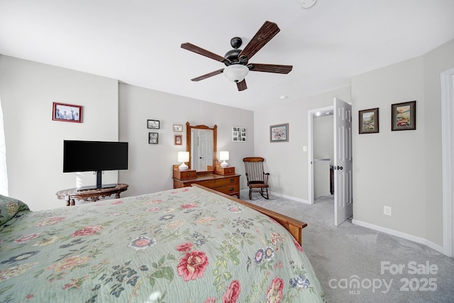 bedroom featuring light carpet, ceiling fan, and baseboards