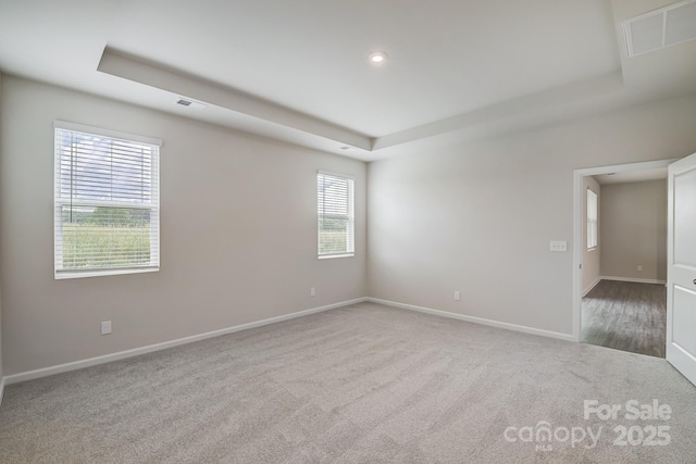 2656 Tillman St, Monroe, NC 28112 - spare room featuring a tray ceiling, carpet flooring, baseboards, and recessed lighting