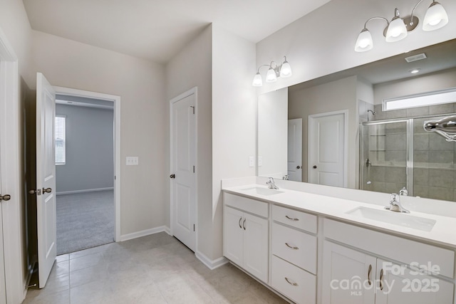2656 Tillman St, Monroe, NC 28112 - bathroom with a stall shower, tile patterned flooring, healthy amount of natural light, and double vanity