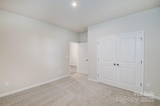 2656 Tillman St, Monroe, NC 28112 - unfurnished bedroom with baseboards, carpet, and a closet
