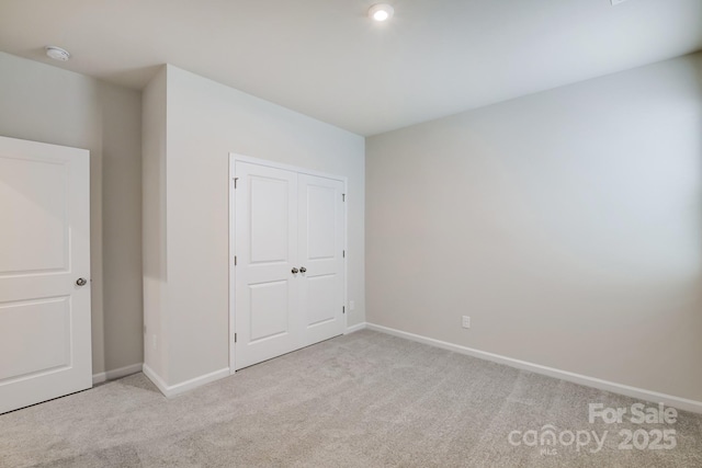 2656 Tillman St, Monroe, NC 28112 - unfurnished bedroom featuring carpet, baseboards, and a closet