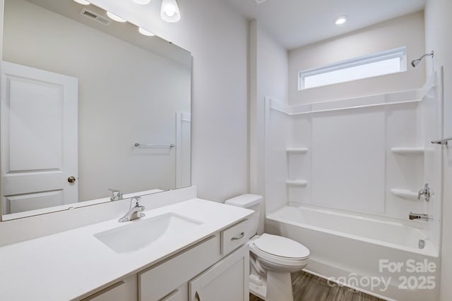2656 Tillman St, Monroe, NC 28112 - bathroom with toilet, wood finished floors, vanity, and shower / bathtub combination
