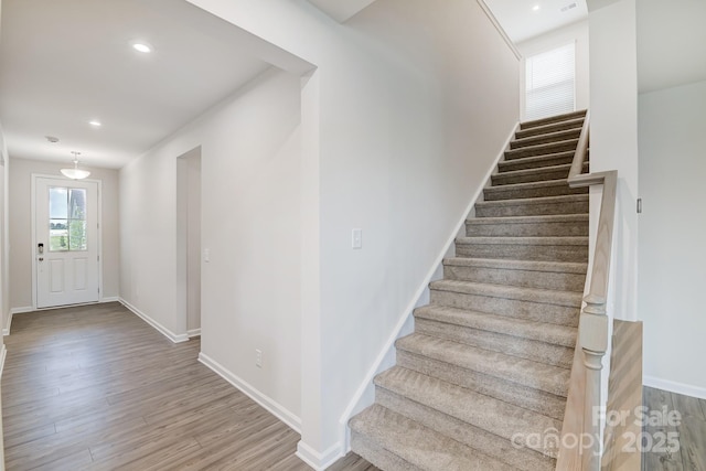 2656 Tillman St, Monroe, NC 28112 - stairs with wood finished floors, baseboards, and recessed lighting