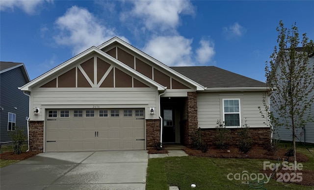 2656 Tillman St, Monroe, NC 28112 - craftsman inspired home featuring stone siding, driveway, a garage, and a front lawn
