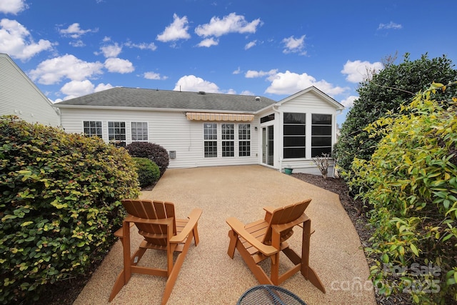 back of property featuring a patio area