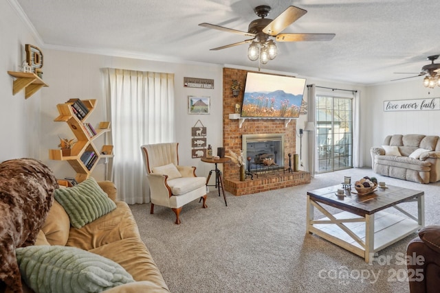 living room featuring a textured ceiling, carpet, a fireplace, and crown molding