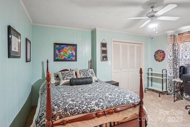 bedroom with a ceiling fan, carpet, a closet, and crown molding